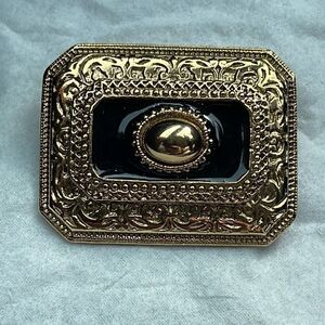 1928 gold tone enamel brooch
